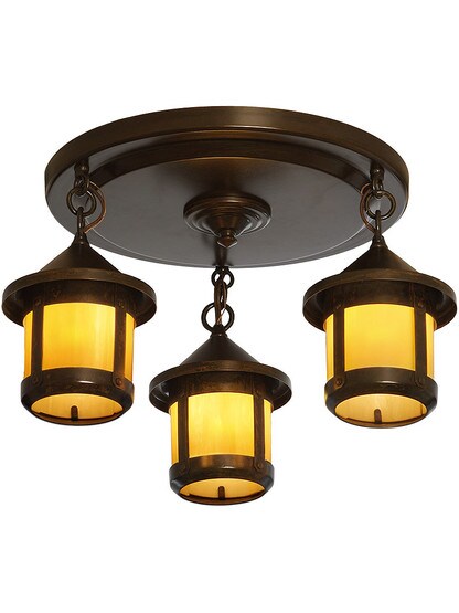 Berkeley Flush Mount 3 Light Fixture in Bronze Finish with Tan Glass.